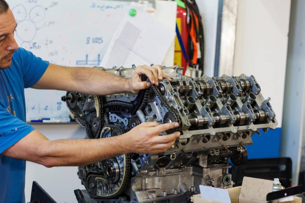 man-working-in-his-mechanical-workshop-on-engine-repairs